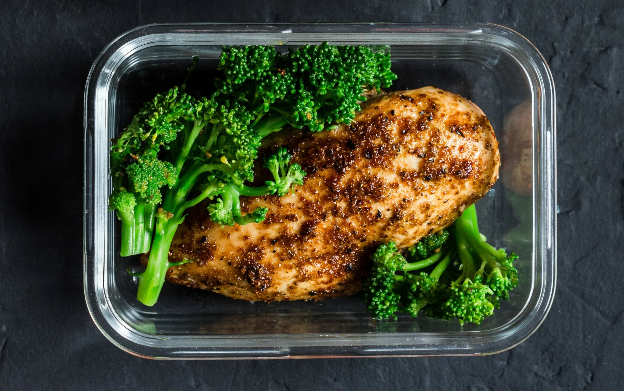 Two,healthy,balanced,lunch,boxes,with,greek,salad,,baked,chicken