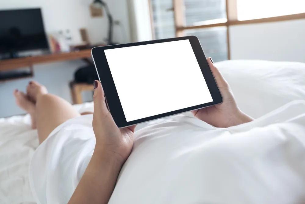 Mockup,image,of,woman's,hands,holding,black,tablet,pc,with