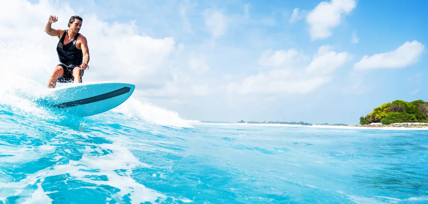 Huraa,,,maldives,march,10,,2019:,young,man,surfs,the